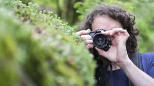 student of devon photography training with digital camera photographing nature